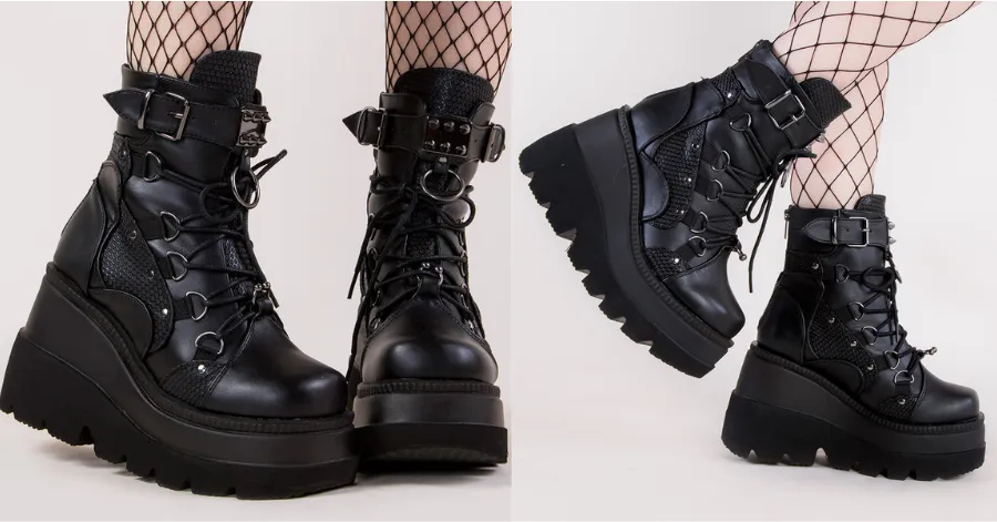 A set of Demonia Shaker-60 Black Vegan Leather Platform Ankle Boots